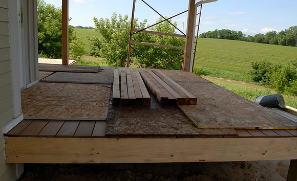 Porch decking is complete and covered up