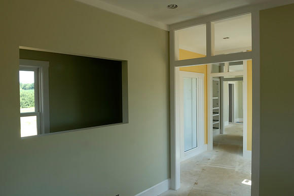 Dining room. There will be a 100 year-old stained glass panel hanging in this opening.