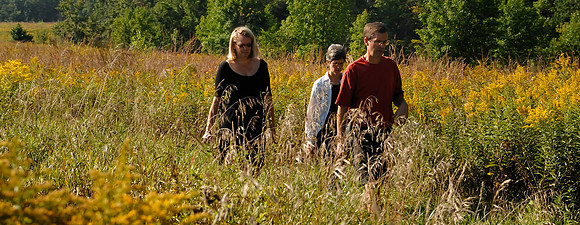 Karen, Jennifer and Jim exploring the local prairie